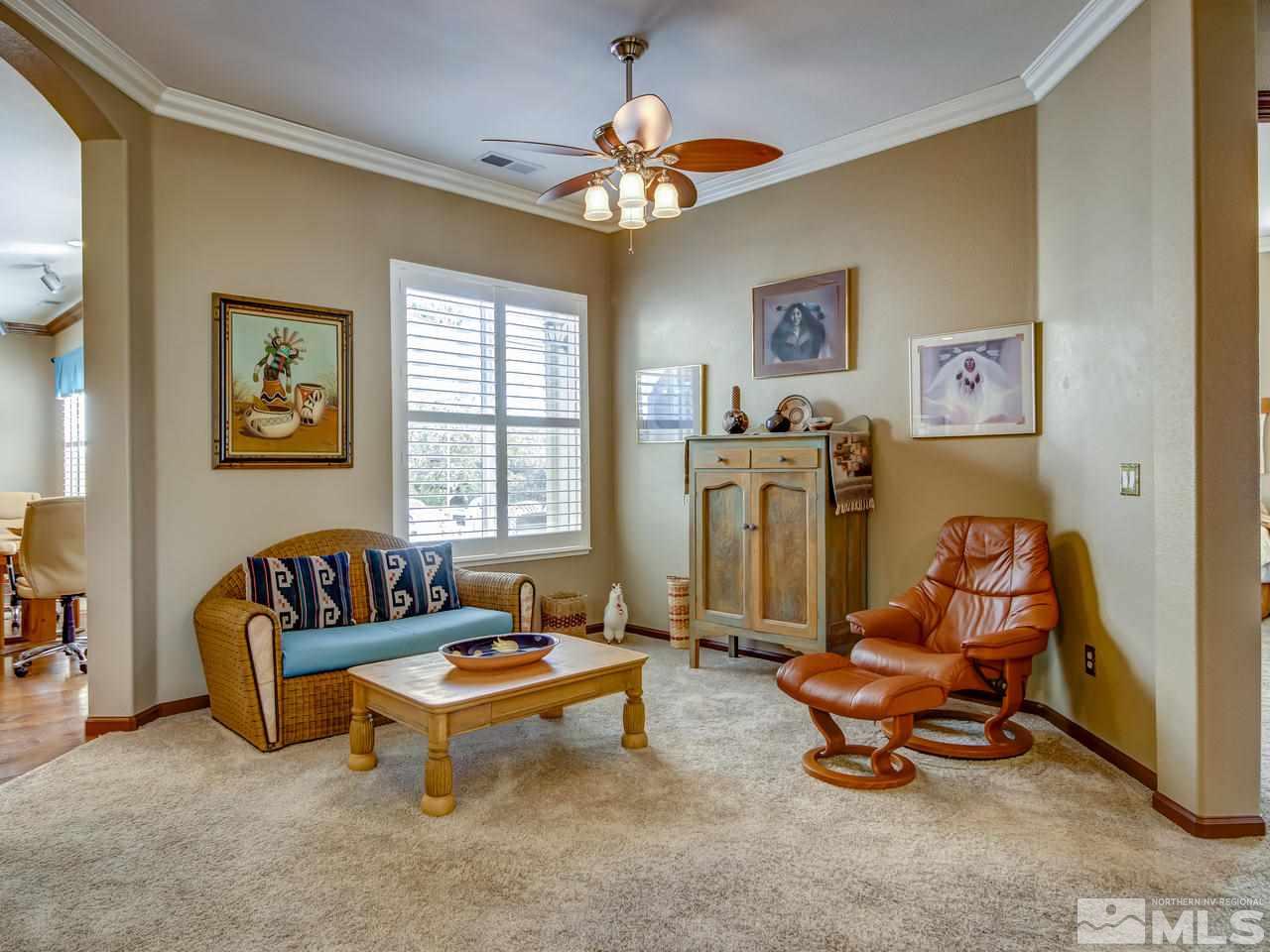 1695 Crater Court Reno, NV 89521 - Photo 4 of 25 a living room with furniture and a chandelier
