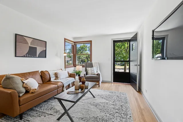 a living room with furniture and a rug