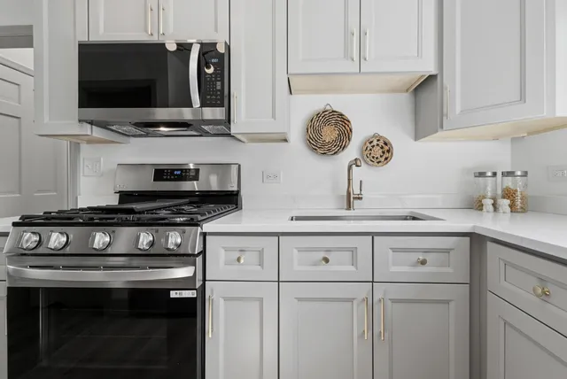 a kitchen with a stove and a sink
