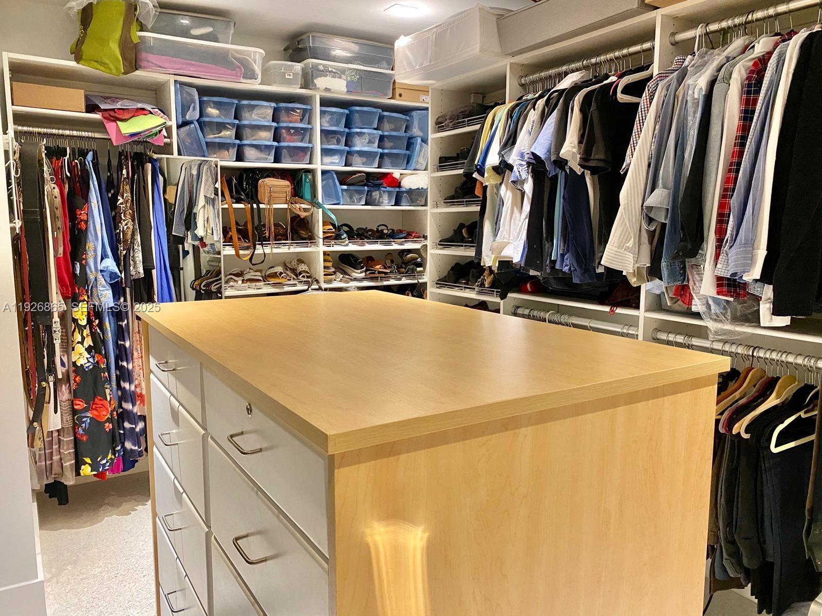 9121 Southwest 85th Street, Unit 2 Miami, FL 33173 - Photo 23 of 26 a view of walk in closet with clothes and shoes