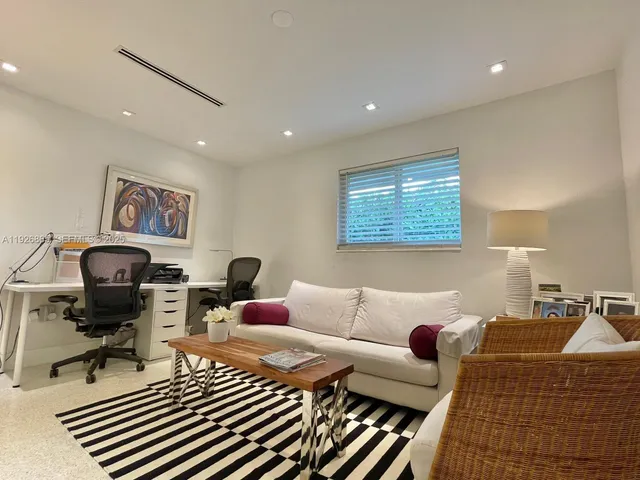 a living room with furniture or couch and a flat screen tv