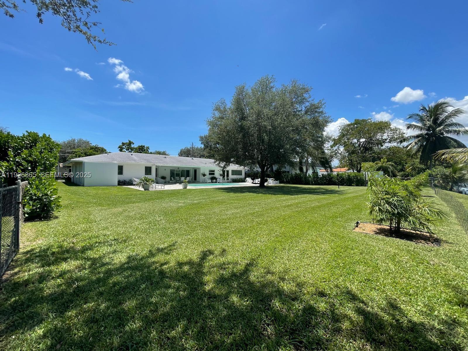 9121 Southwest 85th Street, Unit 2 Miami, FL 33173 - Photo 7 of 26 a view of a house with a big yard