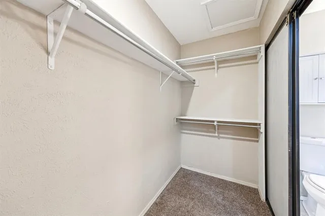 a view of an empty walk in closet