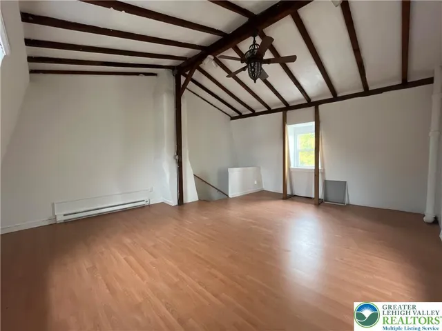 a view of an empty room with a window