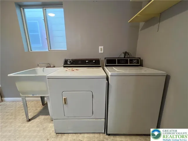 a utility room with dryer and washer