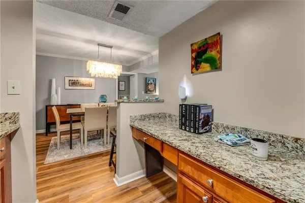 a kitchen with granite countertop counter space a sink cabinets and stainless steel appliances