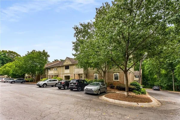 a view of a car park in front of house