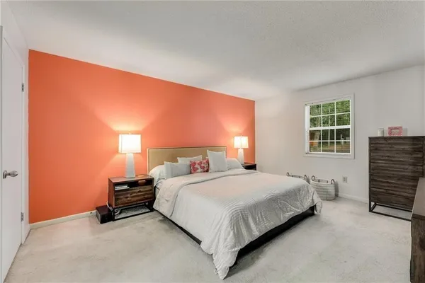a bedroom with a bed and a closet
