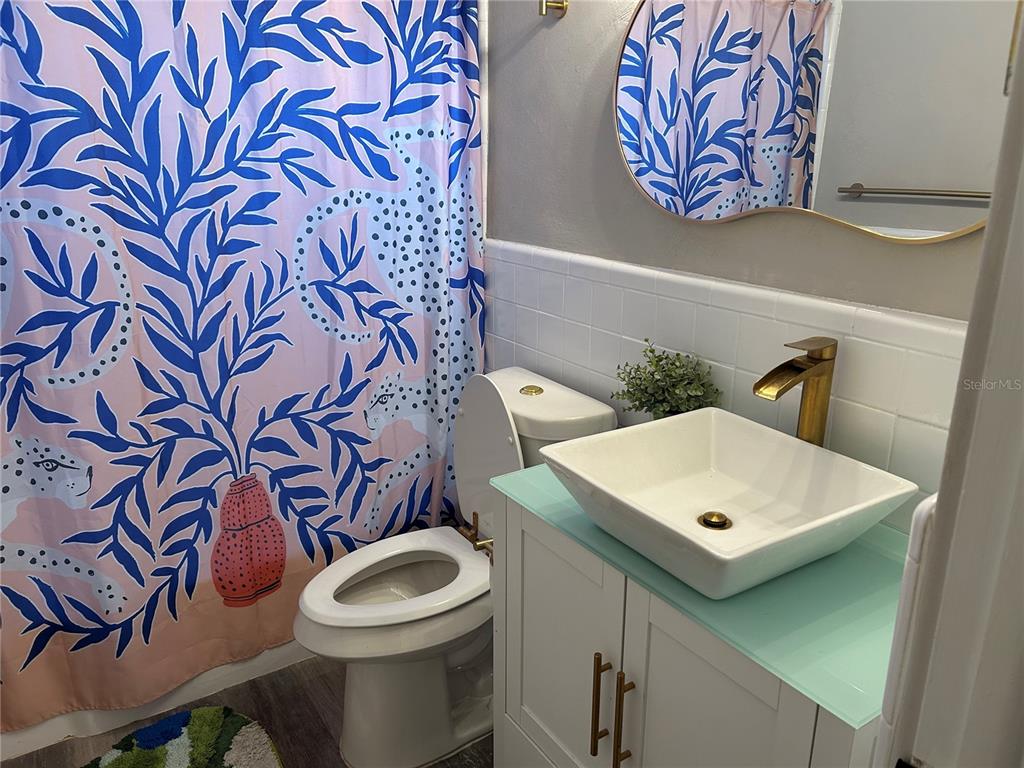3320 Conway Gardens Road Orlando, FL 32806 - Photo 11 of 21 a bathroom with a toilet and a sink