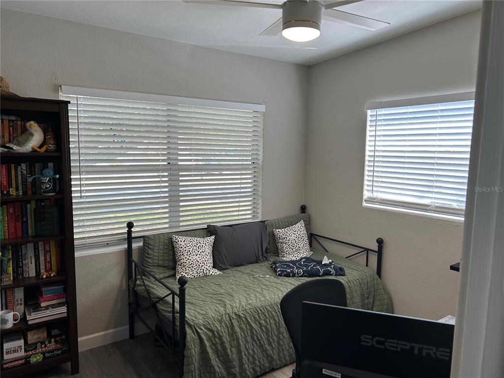 3320 Conway Gardens Road Orlando, FL 32806 - Photo 14 of 21 a bedroom with a bed and a window