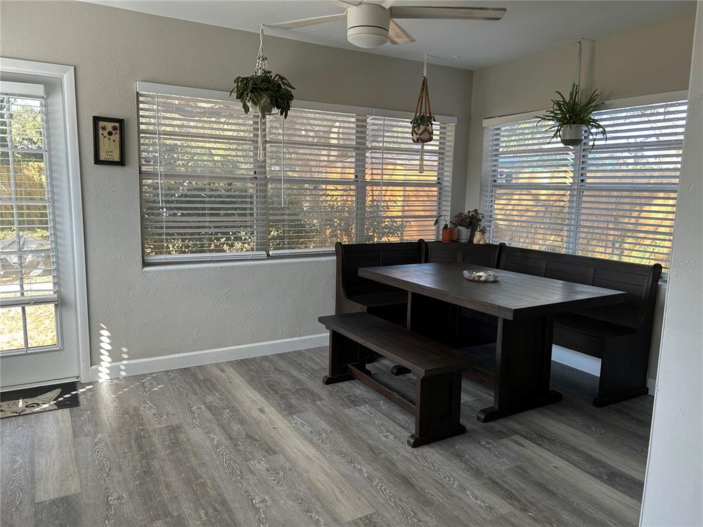 3320 Conway Gardens Road Orlando, FL 32806 - Photo 3 of 21 a room with wooden floor and windows