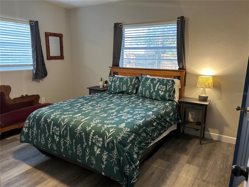 3320 Conway Gardens Road Orlando, FL 32806 - Photo 6 of 21 a bed sitting in a bedroom next to a window