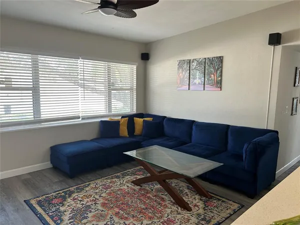 a living room with a couch and a window