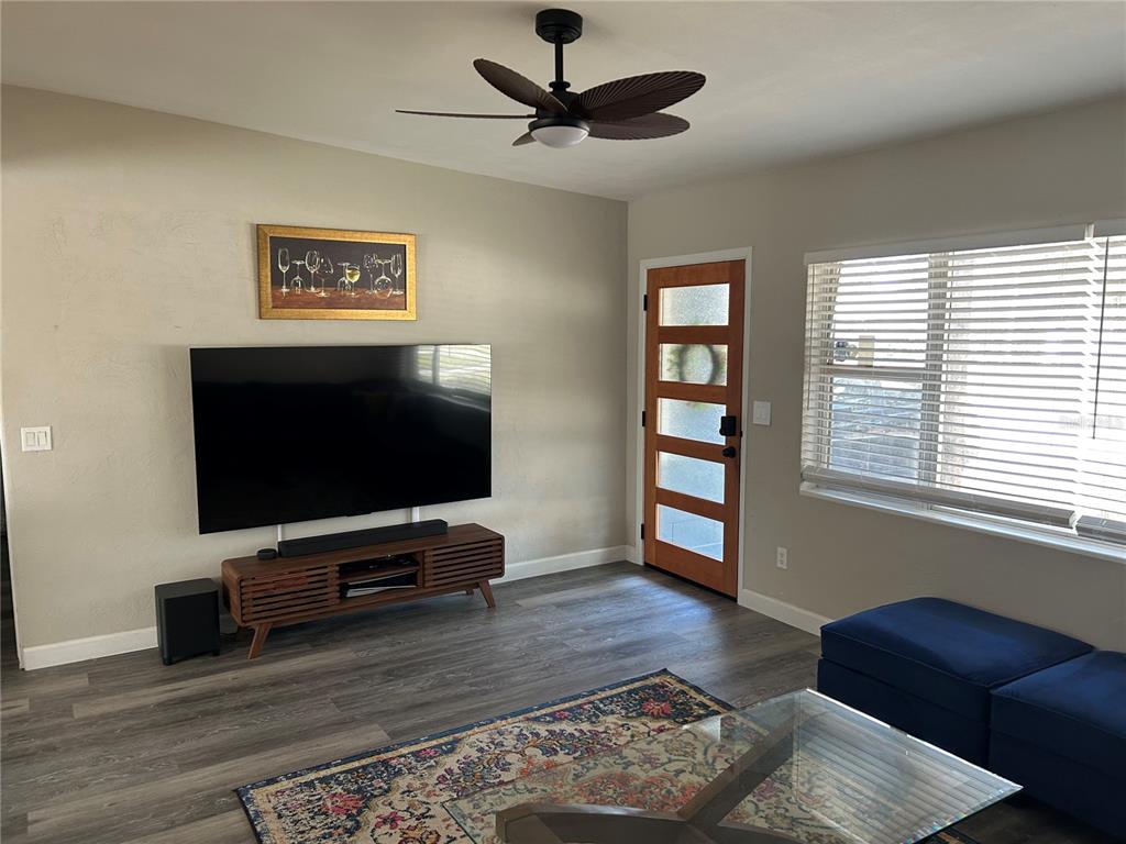 3320 Conway Gardens Road Orlando, FL 32806 - Photo 10 of 21 a living room with furniture and a flat screen tv