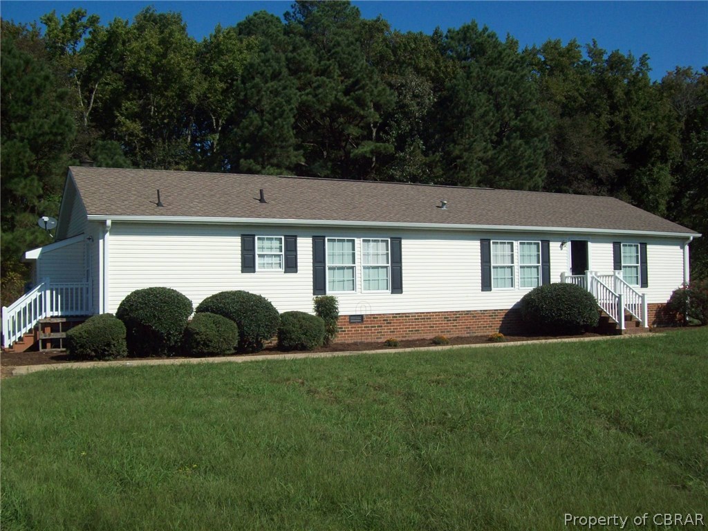 133 Dixon Road Hudgins, VA 23076 - Photo 1 of 25 a house view with a garden space