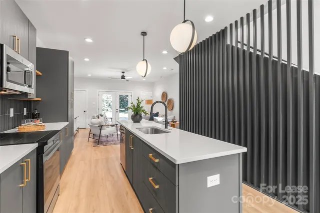 a kitchen with a sink and cabinets