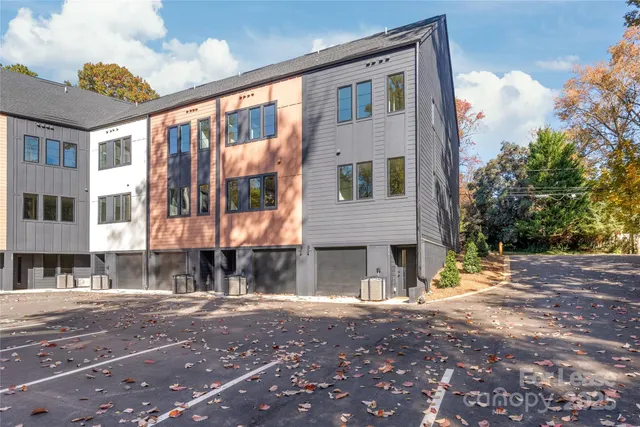 a view of a street with a building in the background