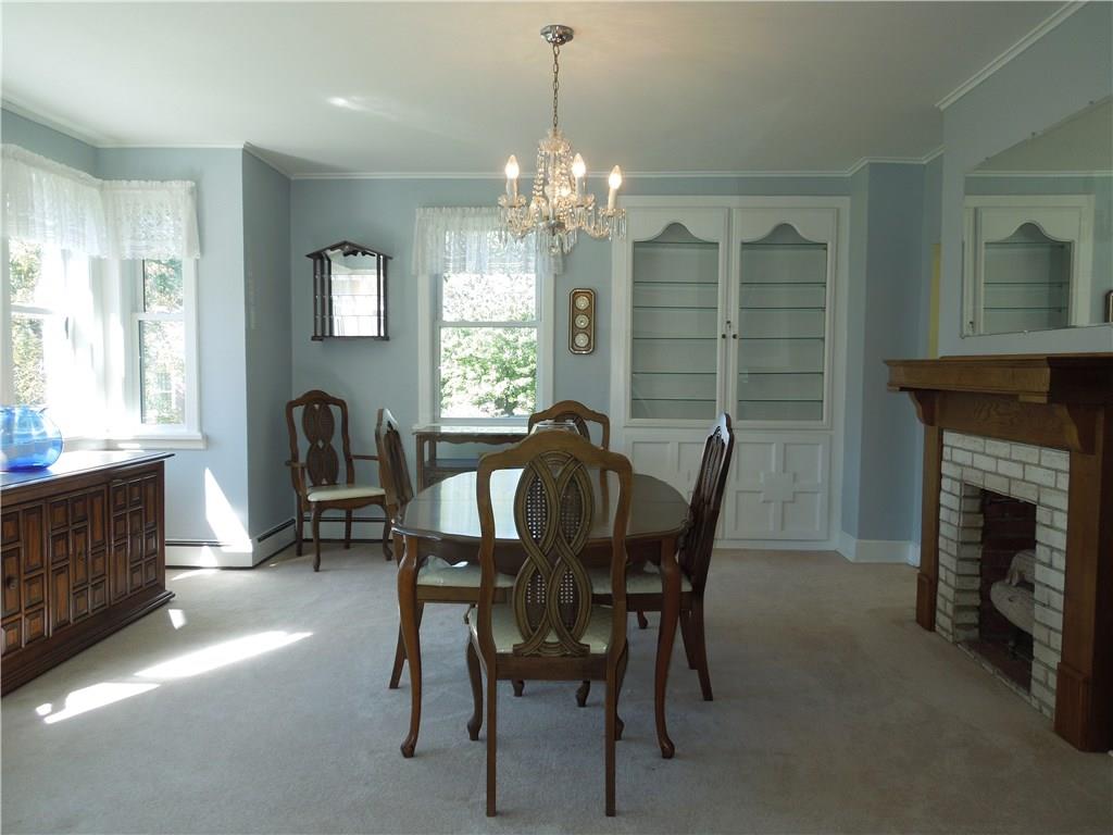 5235 Verona Road Verona, PA 15147 - Photo 5 of 19 Large dining room with built in cabinet, bay window and gas fireplace