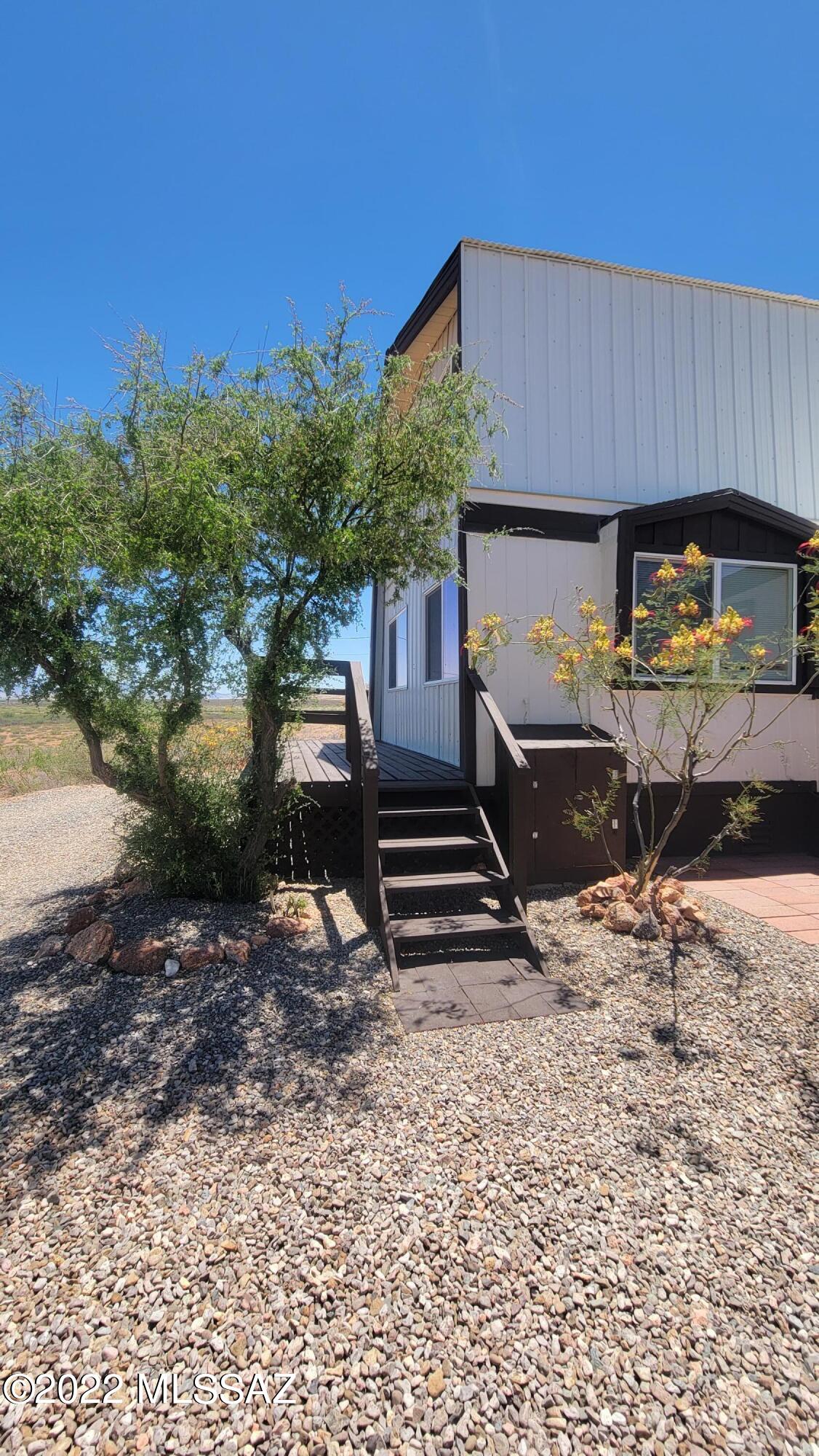 3399 Red Stag Road Pearce, AZ 85625 - Photo 9 of 47 a view of a backyard with a sitting area