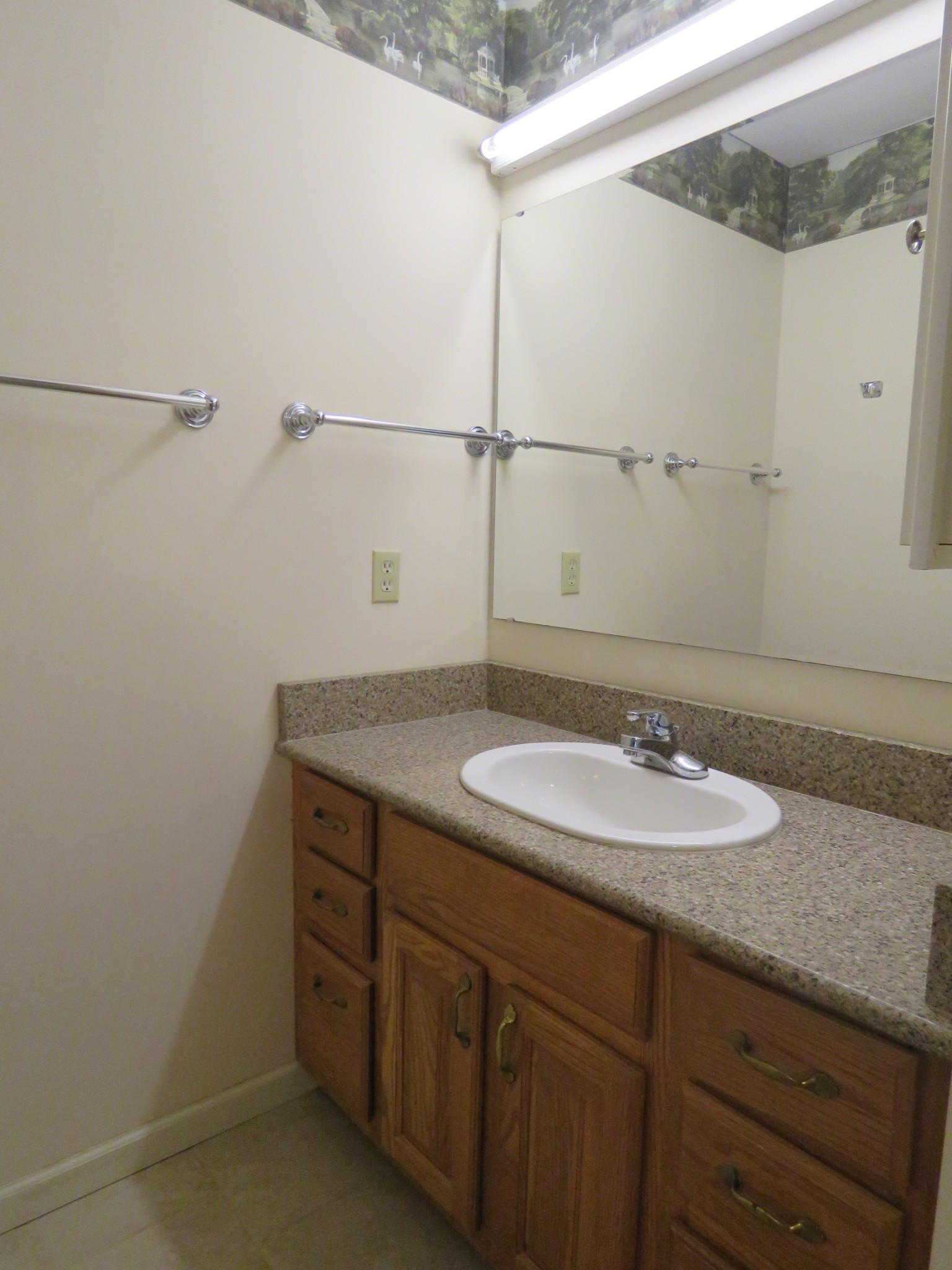 751 Yonside Drive Sparta, TN 38583 - Photo 13 of 36 a bathroom with a granite countertop sink and a mirror