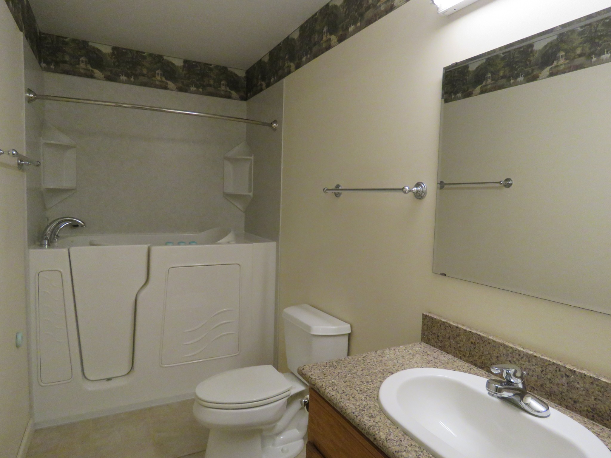 751 Yonside Drive Sparta, TN 38583 - Photo 20 of 36 a bathroom with a granite countertop sink toilet and shower