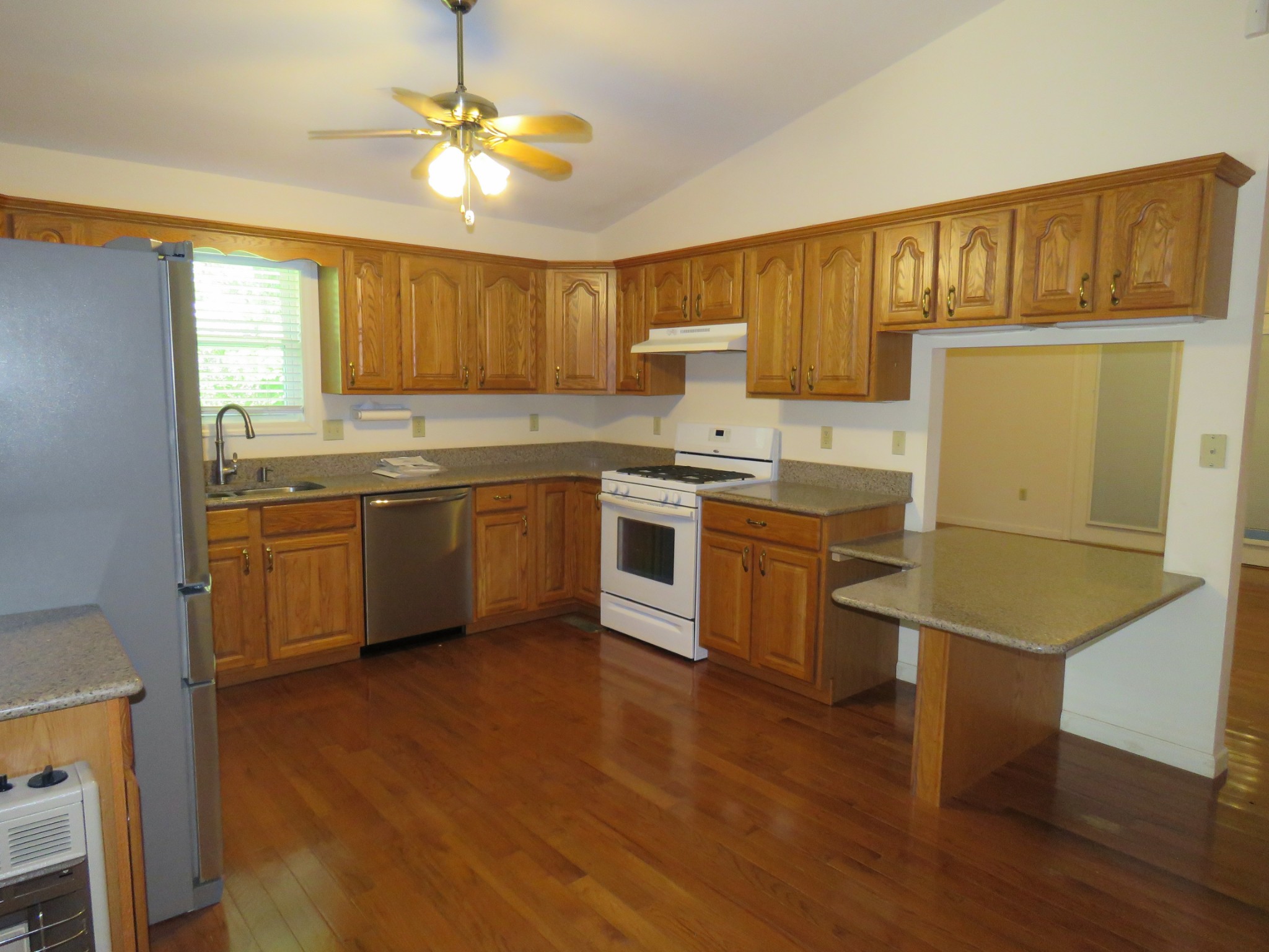 751 Yonside Drive Sparta, TN 38583 - Photo 5 of 36 a kitchen with a sink cabinets and wooden floor