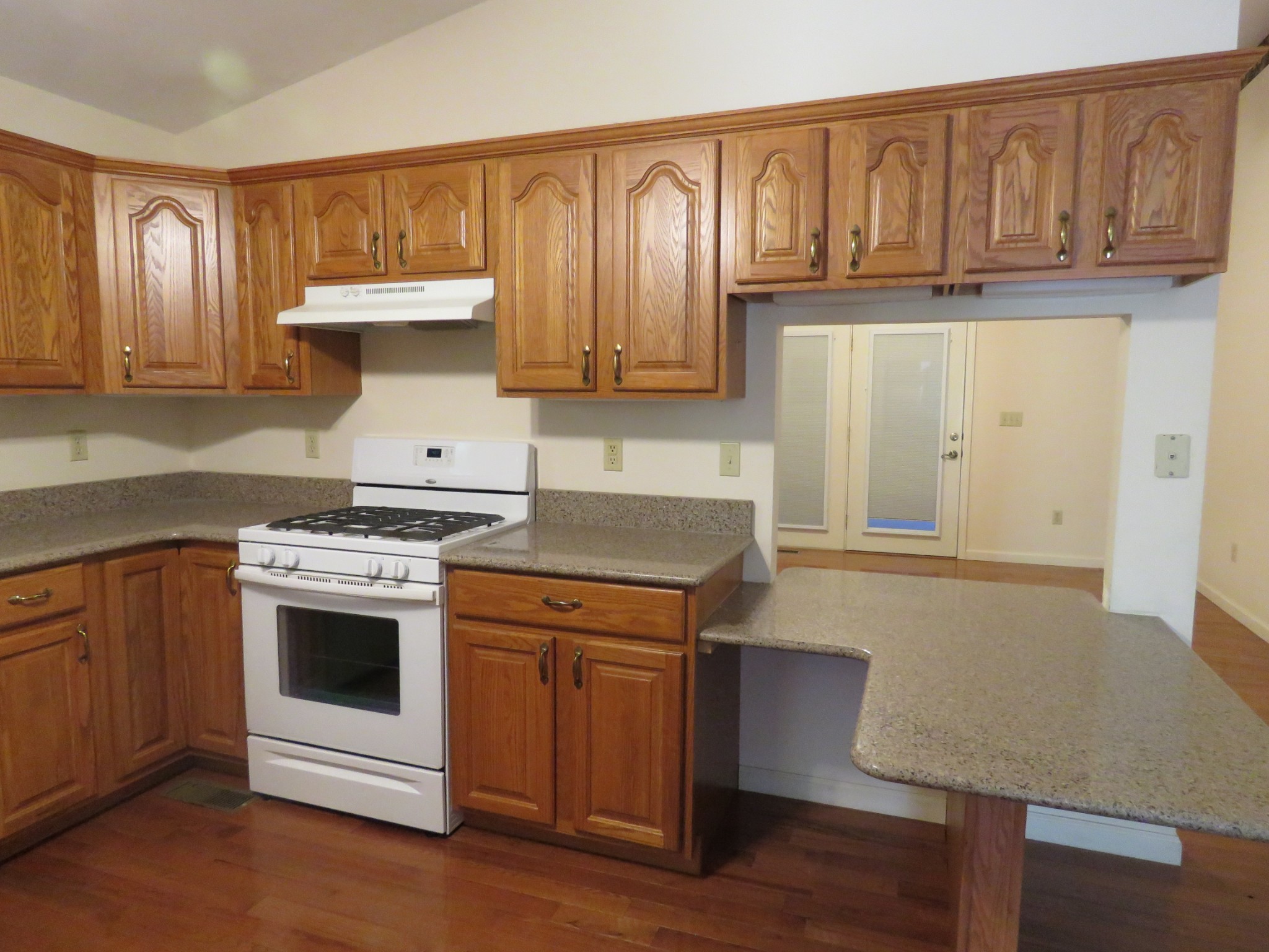 751 Yonside Drive Sparta, TN 38583 - Photo 8 of 36 a kitchen with granite countertop a stove and a refrigerator