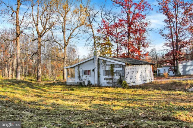 a view of swimming pool with outdoor seating