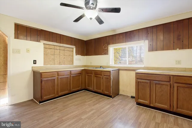 a kitchen with a stove a sink and a refrigerator