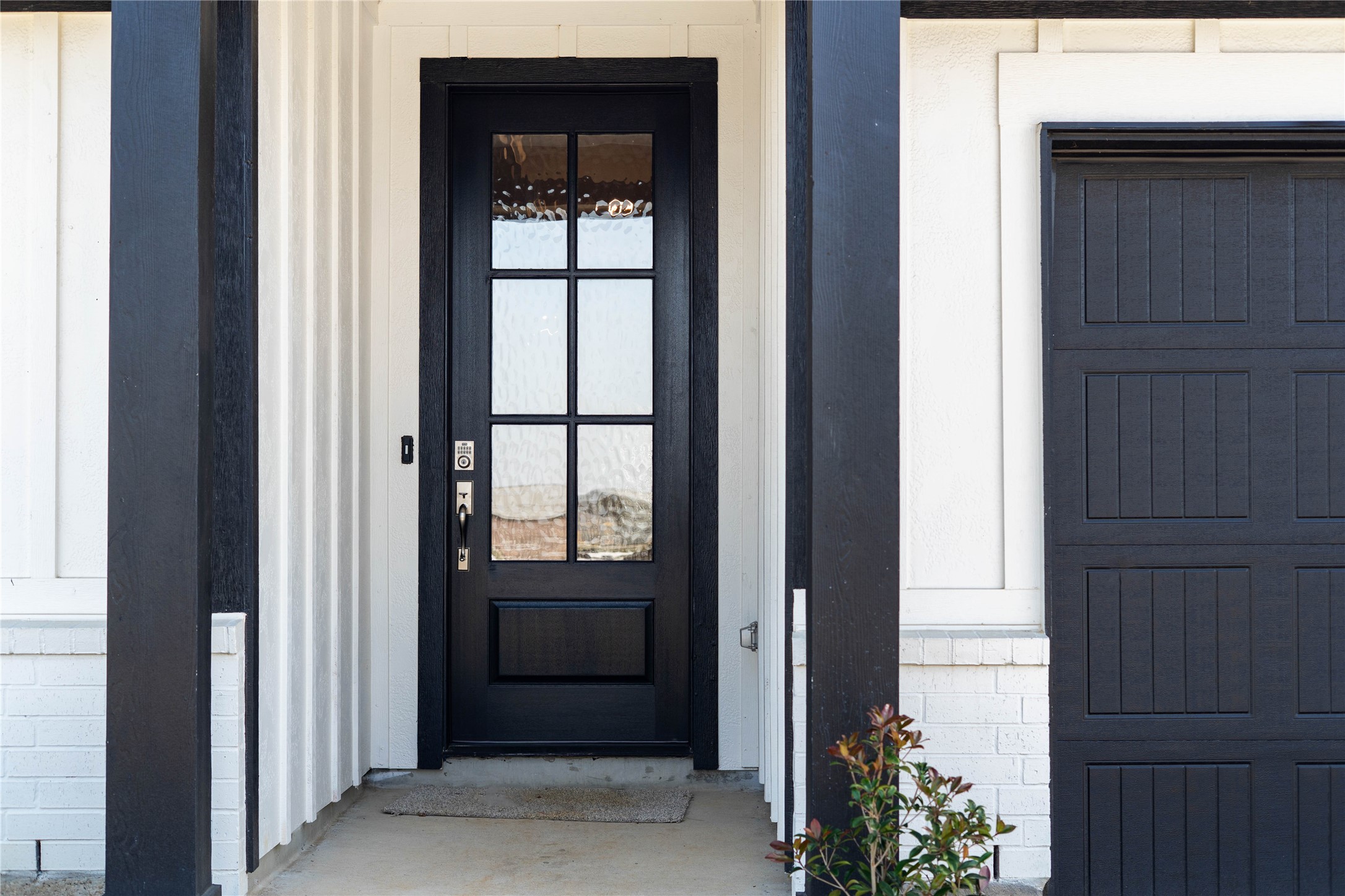 19645 Montgomery Rdg Way Montgomery, TX 77316 - Photo 5 of 41 Exceptional curb appeal defines this residence. It features a bold matte black six-lite door with glass panes making it the focal point for this modern farmhouse entryway.