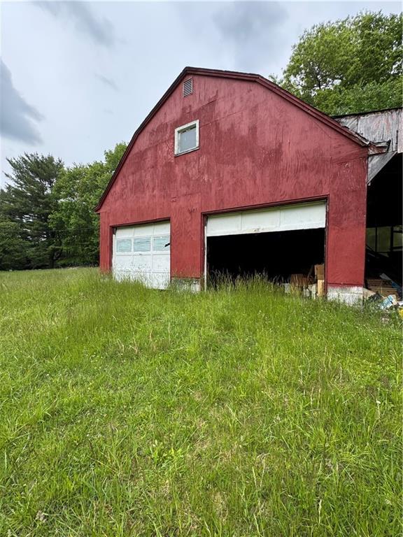 1547 Rishell Road Rossiter, PA 15772 - Photo 4 of 11 a front view of a house with yard and a garage