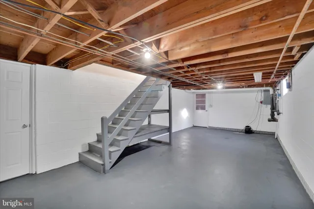 a view of an empty room with white walls