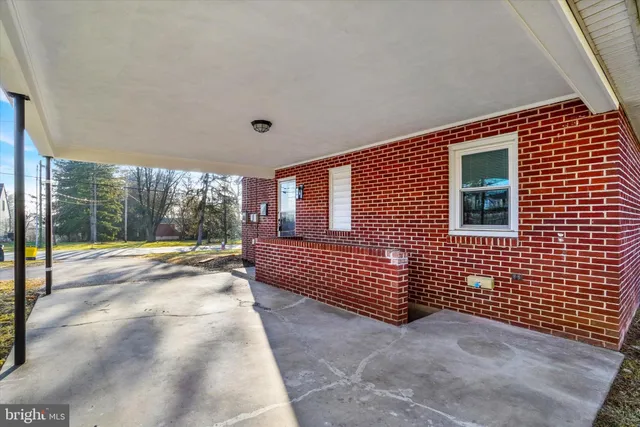 a view of a porch with a bench