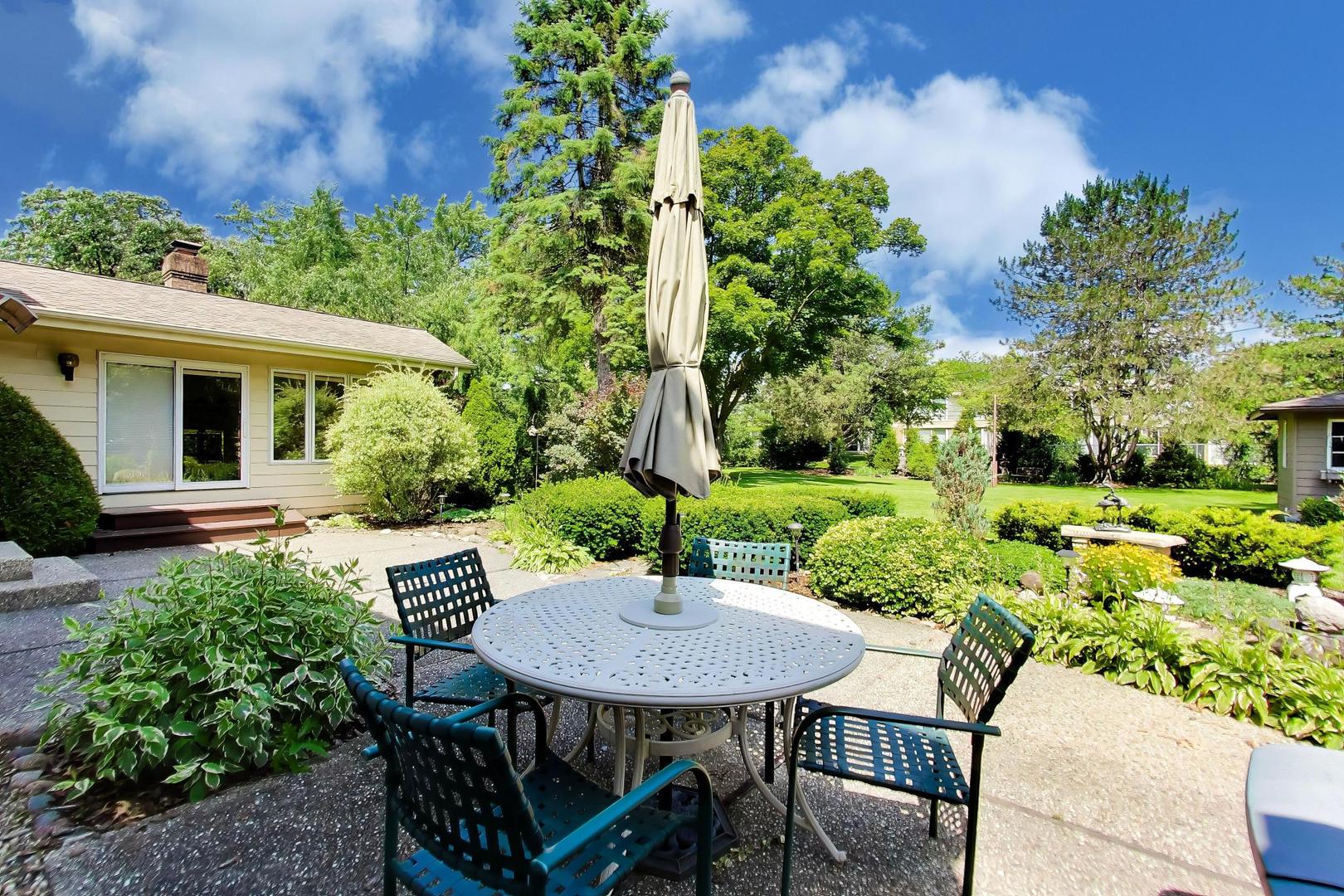 103 Cottonwood Road Northbrook, IL 60062 - Photo 42 of 50 a view of a backyard with table and chairs