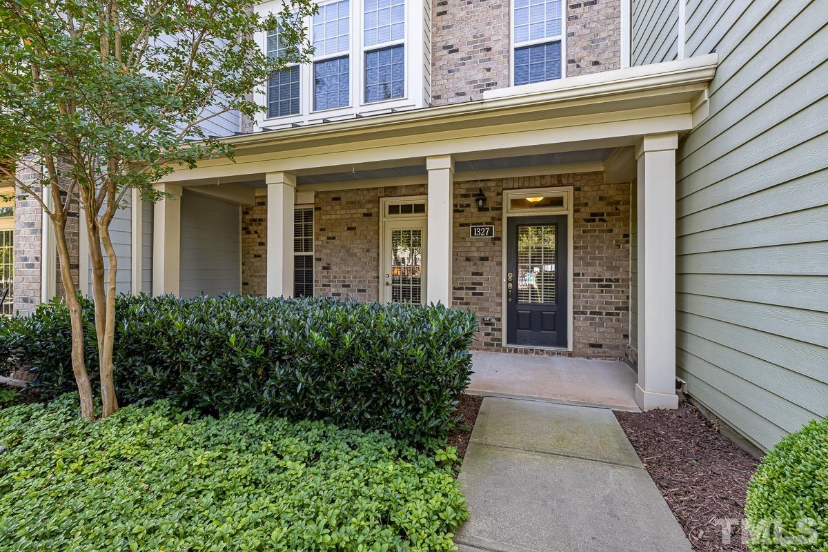 1327 Rembrandt Circle Raleigh, NC 27607 - Photo 2 of 41 front view of a brick house with a large window