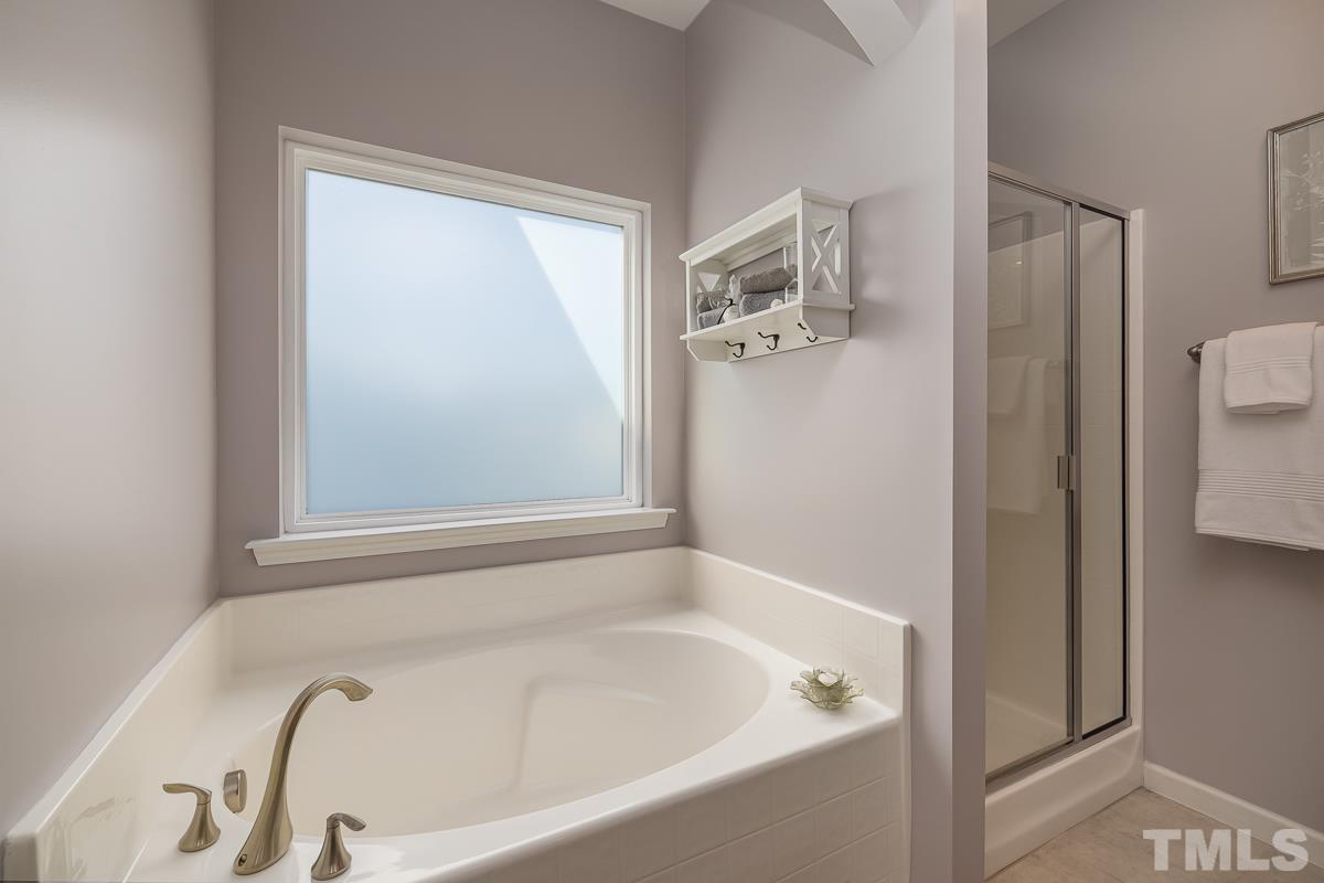 1327 Rembrandt Circle Raleigh, NC 27607 - Photo 28 of 41 a bathroom with a tub and shower