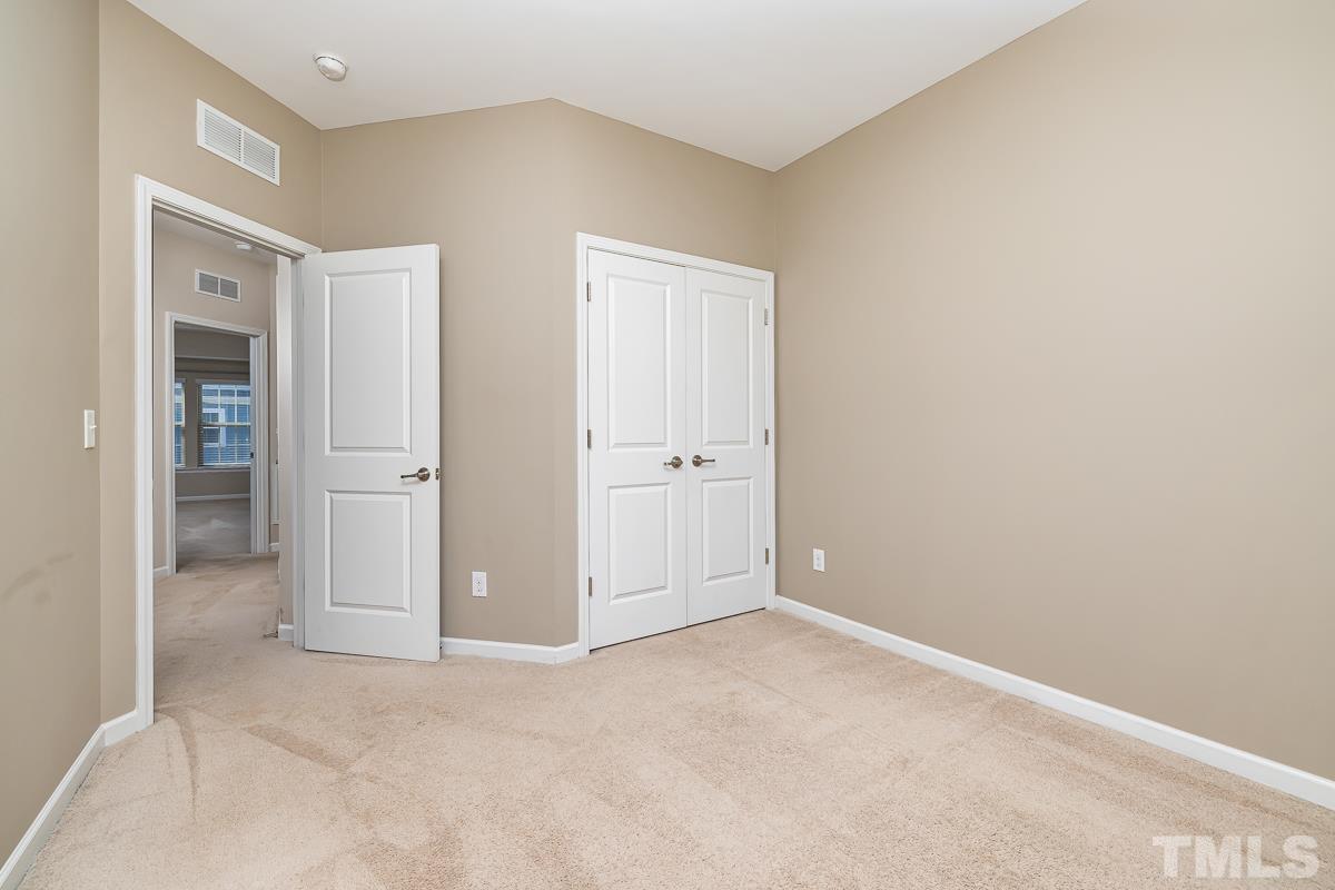 1327 Rembrandt Circle Raleigh, NC 27607 - Photo 31 of 41 an empty room with an entrance to other room