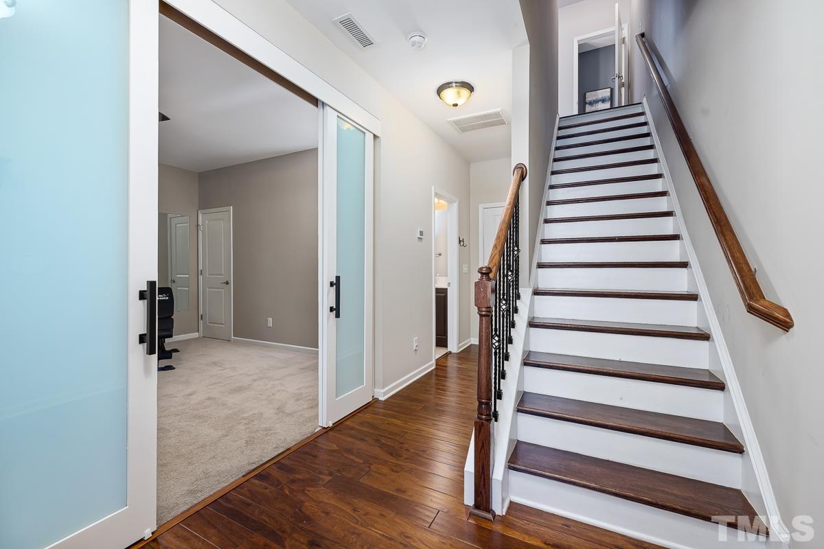 1327 Rembrandt Circle Raleigh, NC 27607 - Photo 4 of 41 a view of a hallway with wooden floor and entryway