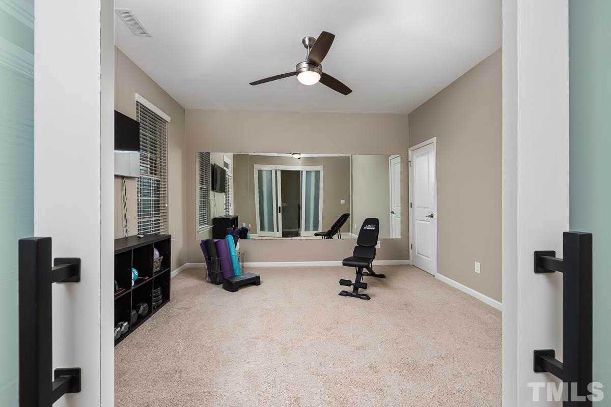 1327 Rembrandt Circle Raleigh, NC 27607 - Photo 6 of 41 a view of living room with furniture and a flat screen tv