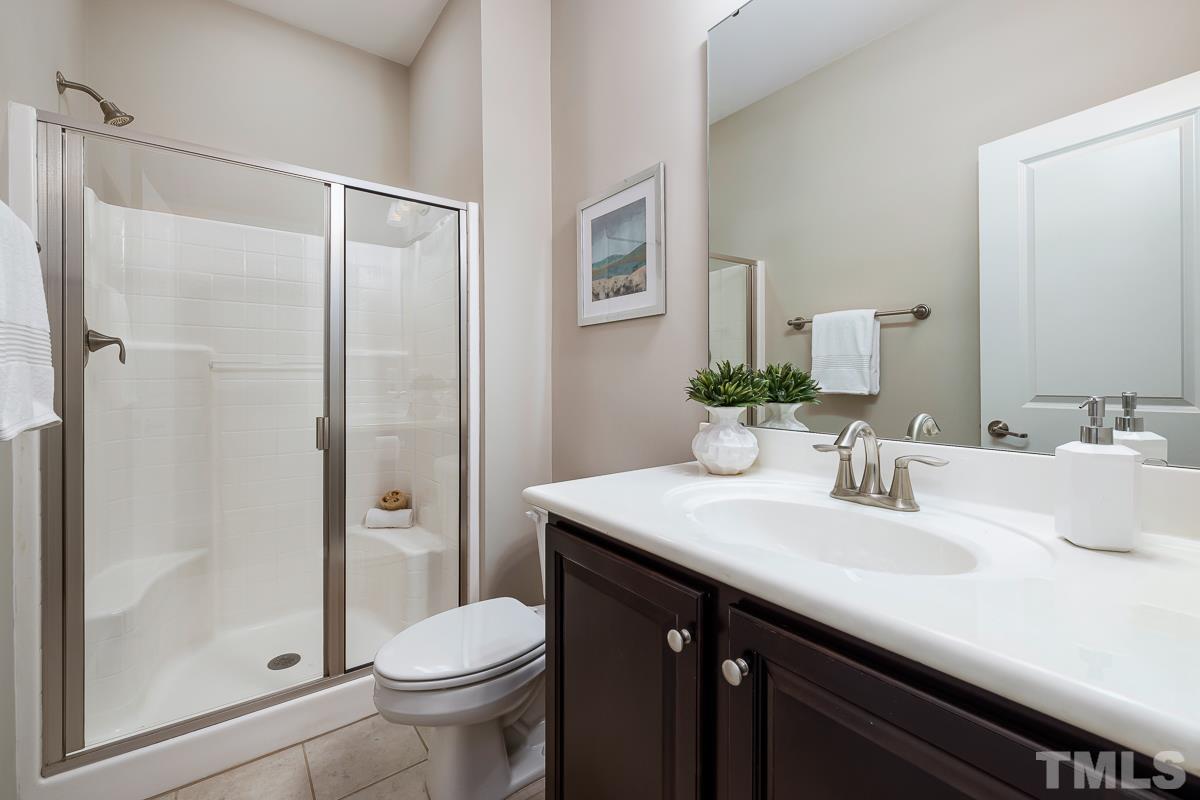1327 Rembrandt Circle Raleigh, NC 27607 - Photo 8 of 41 a bathroom with a sink toilet and shower
