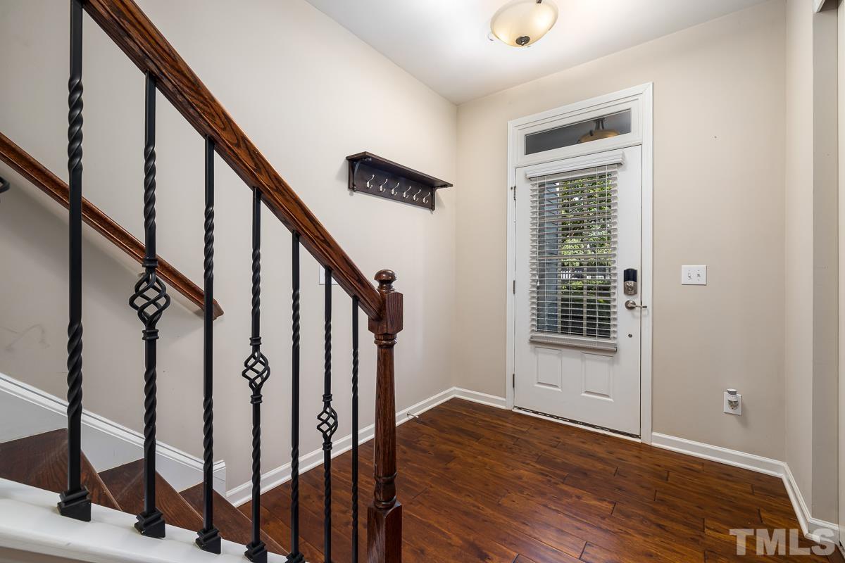 1327 Rembrandt Circle Raleigh, NC 27607 - Photo 9 of 41 a view of an entryway with wooden floor and door