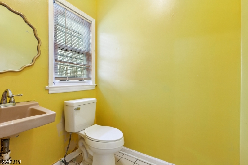 110 Old Turnpike Road Califon, NJ 07830 - Photo 16 of 25 a white toilet sitting next to a bathroom sink and vanity
