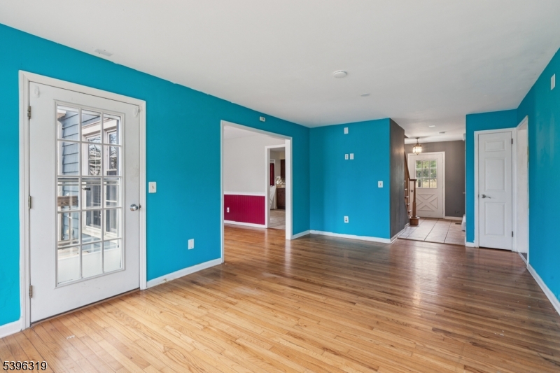 110 Old Turnpike Road Califon, NJ 07830 - Photo 18 of 25 a view of an empty room with wooden floor and windows