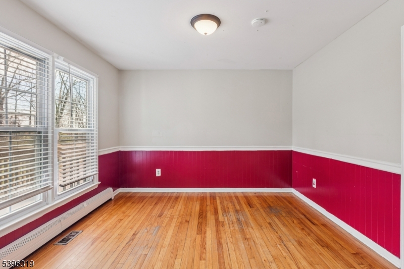 110 Old Turnpike Road Califon, NJ 07830 - Photo 9 of 25 a view of wooden floor and windows in a room