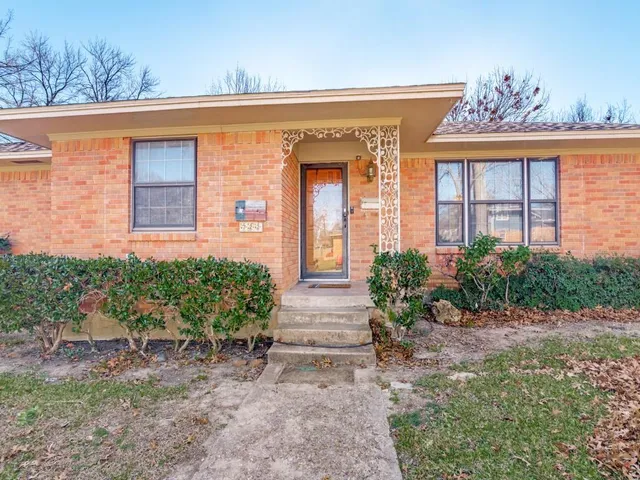 a front view of a house with a porch