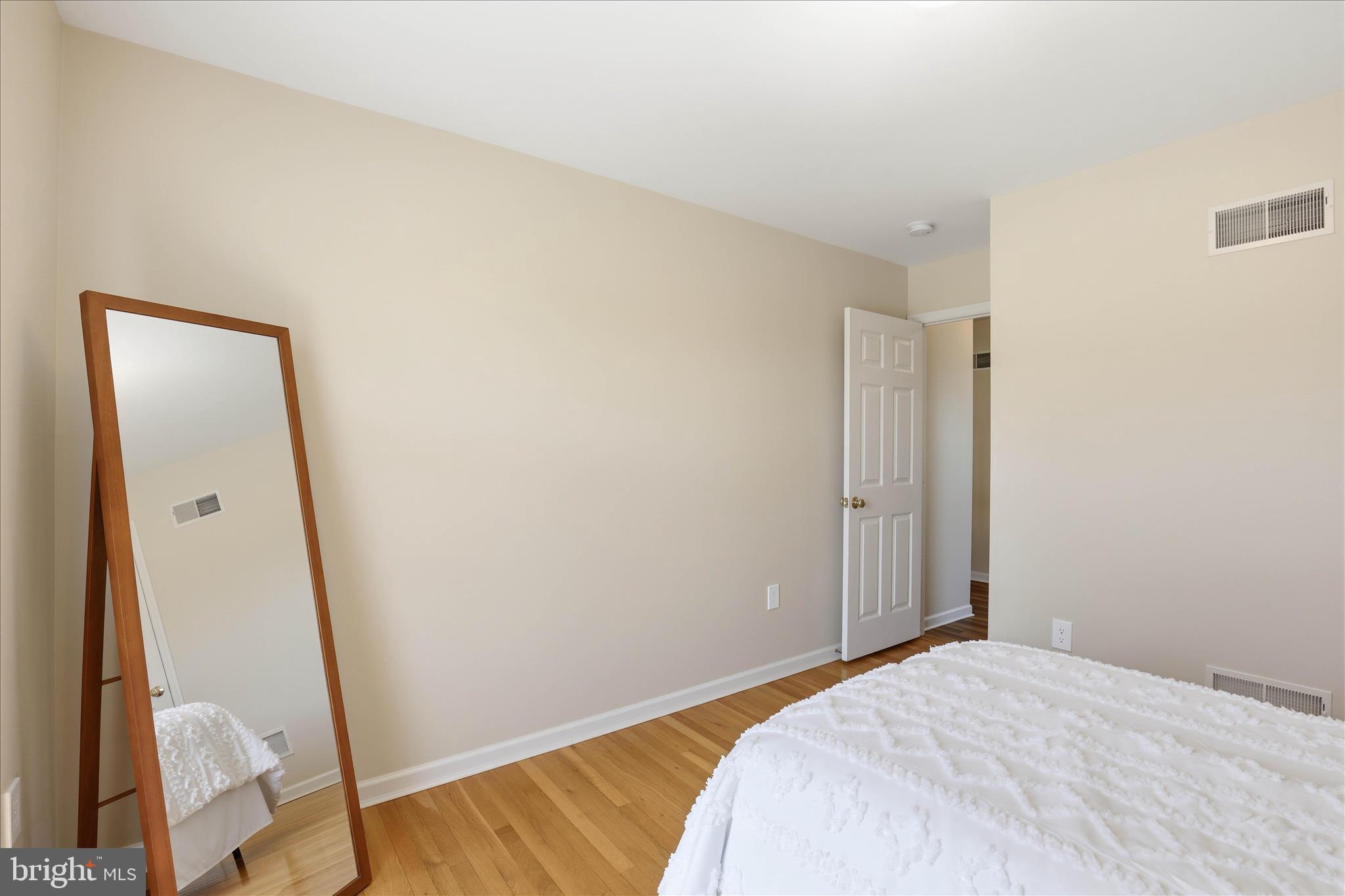 533 Thornberry Lane Lititz, PA 17543 - Photo 36 of 56 a bedroom with a bed and wooden floor