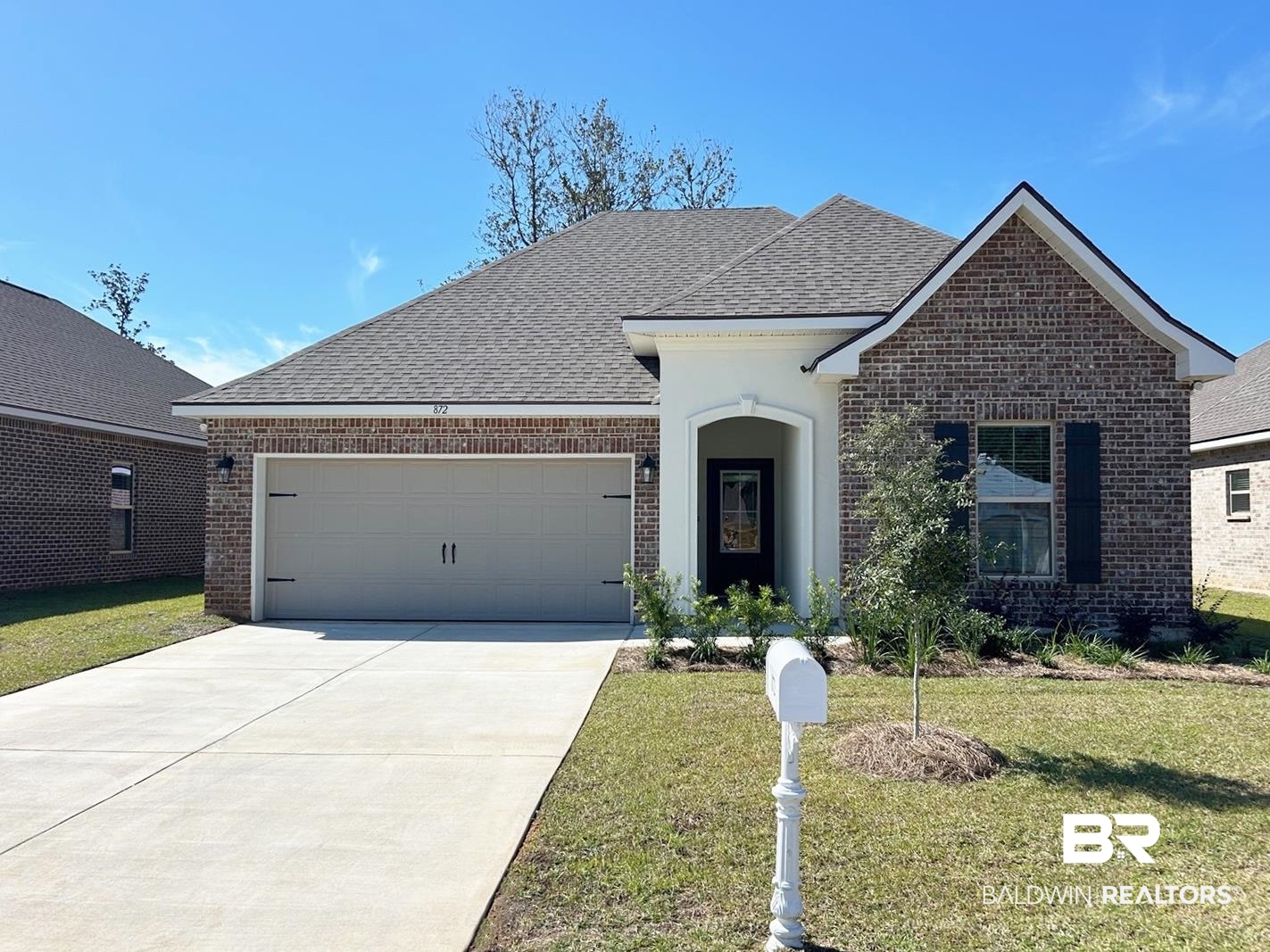872 Sumter Loop Foley, AL 36535 - Photo 1 of 18 View of front of house with a front yard and a garage