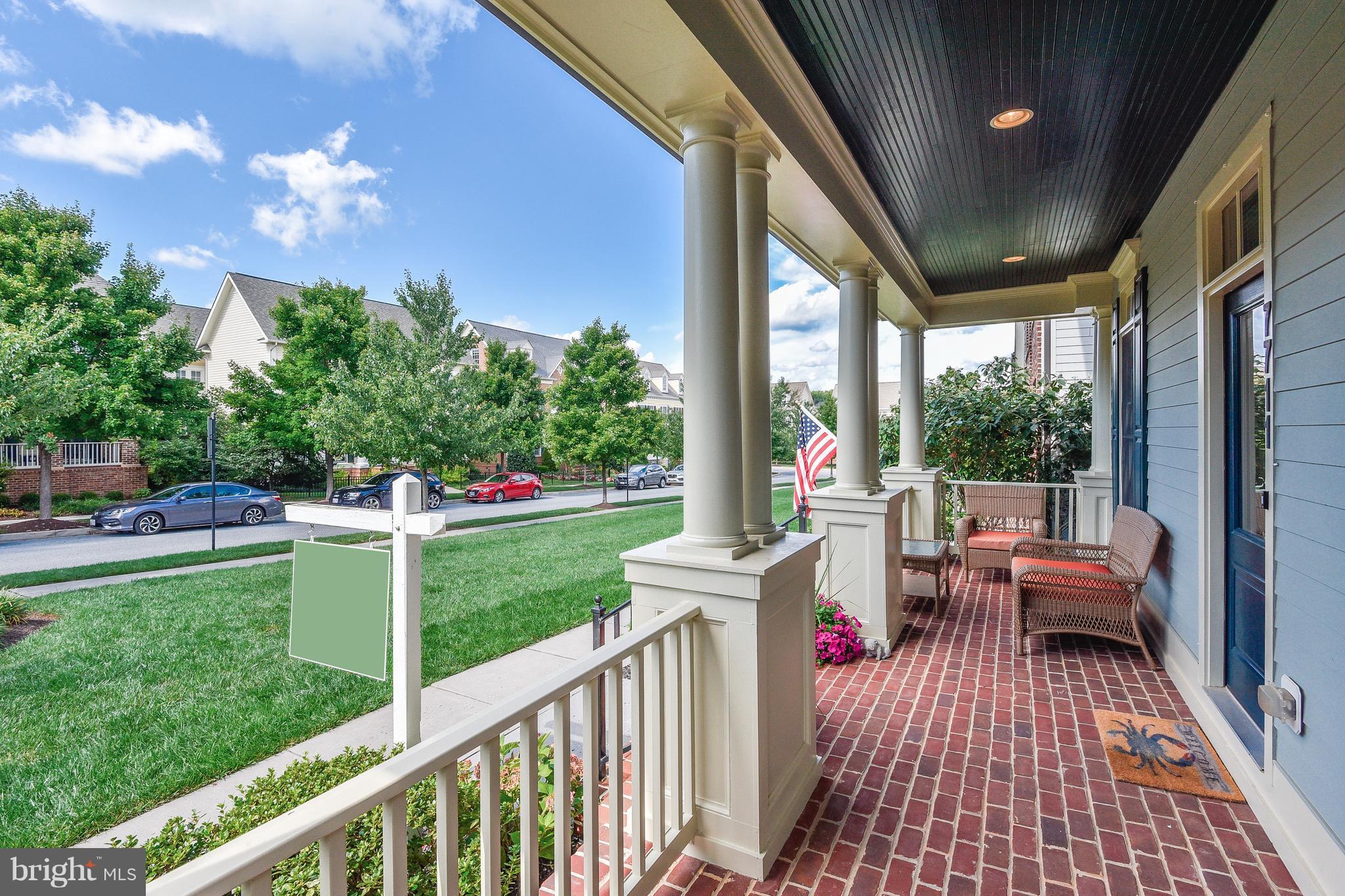 Brick front porch overlooking green space
