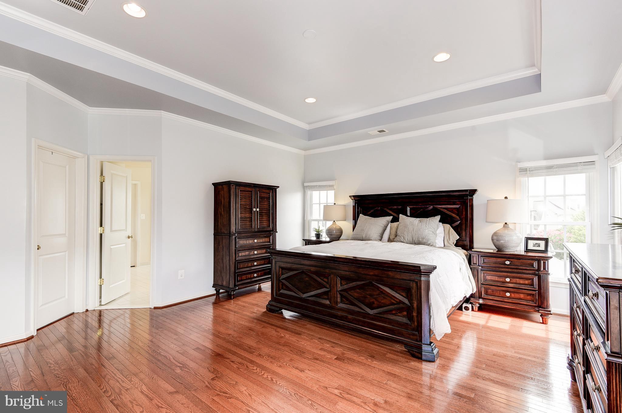 7711 Elmwood Road Fulton, MD 20759 - Photo 15 of 30 Master bedroom with tray ceiling & wood floors