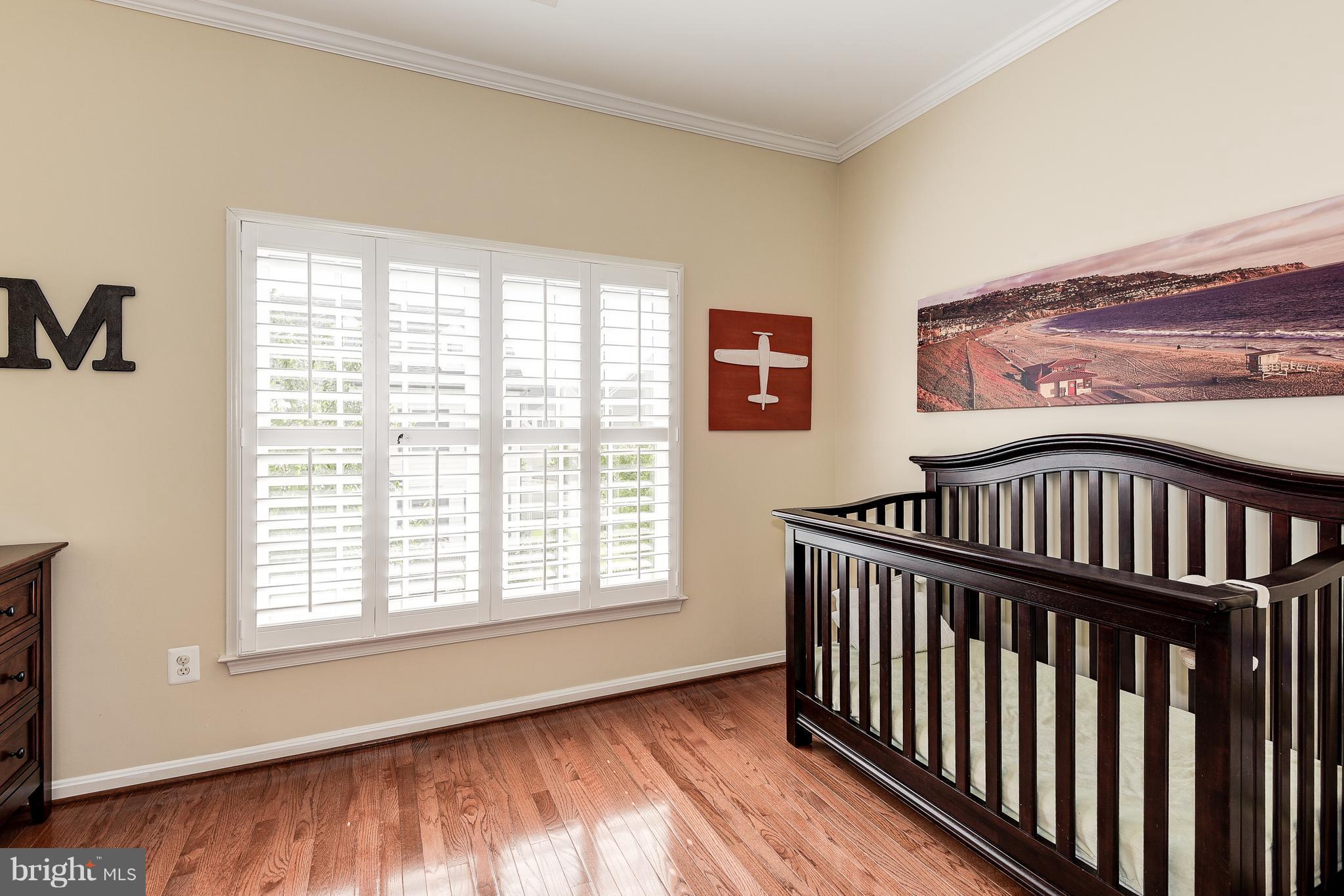 7711 Elmwood Road Fulton, MD 20759 - Photo 21 of 30 Bedroom 4 with wood floors and french doors
